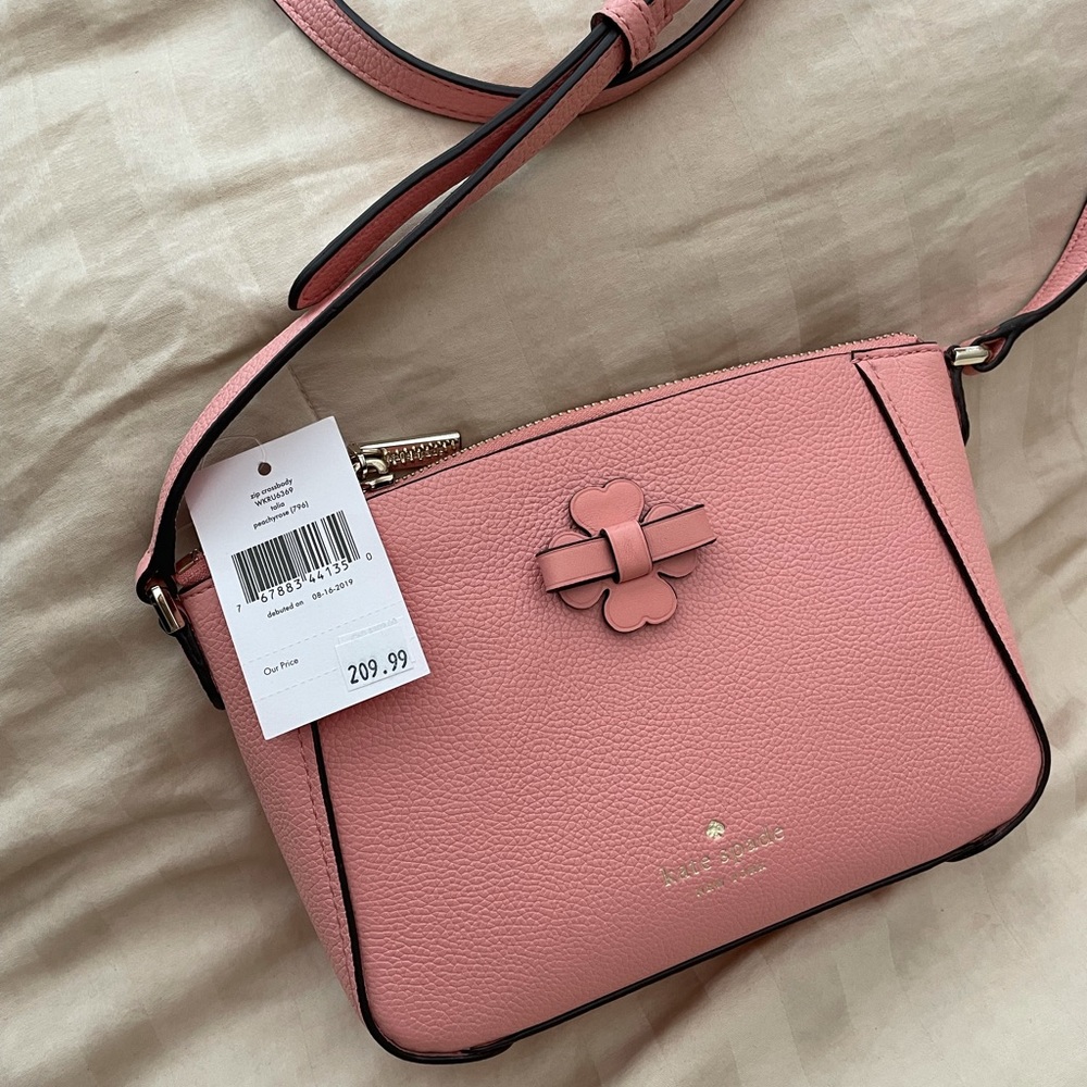 Pink Kate Spade crossbody purse.